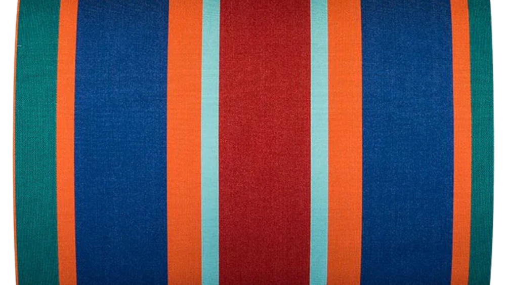 Bold striped sunbrella fabric featuring blue, red, orange, teal, and turquoise stripes