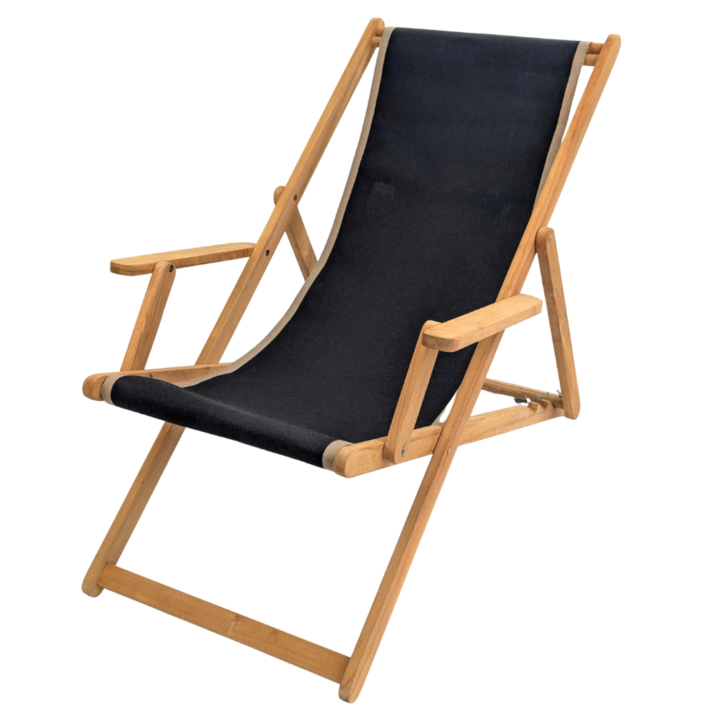 Teak deckchair with arms featuring a cotton Les Toiles du Soleil fabric of solid black with beige border on edges, on a white background.