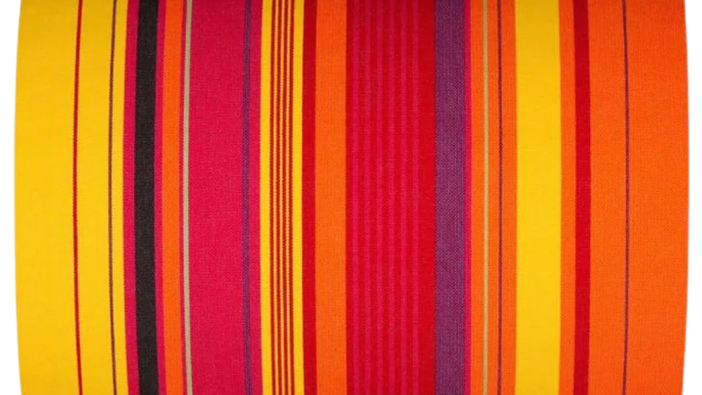 Petit Perpignan Rouge/Soleil is a fabric featuring a striped pattern with various bands of vibrant warm shades. A detailed 100% cotton weave by By Les Toiles du Soleil