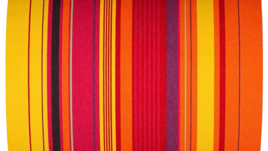 Petit Perpignan Rouge/Soleil is a fabric featuring a striped pattern with various bands of vibrant warm shades. A detailed 100% cotton weave by By Les Toiles du Soleil