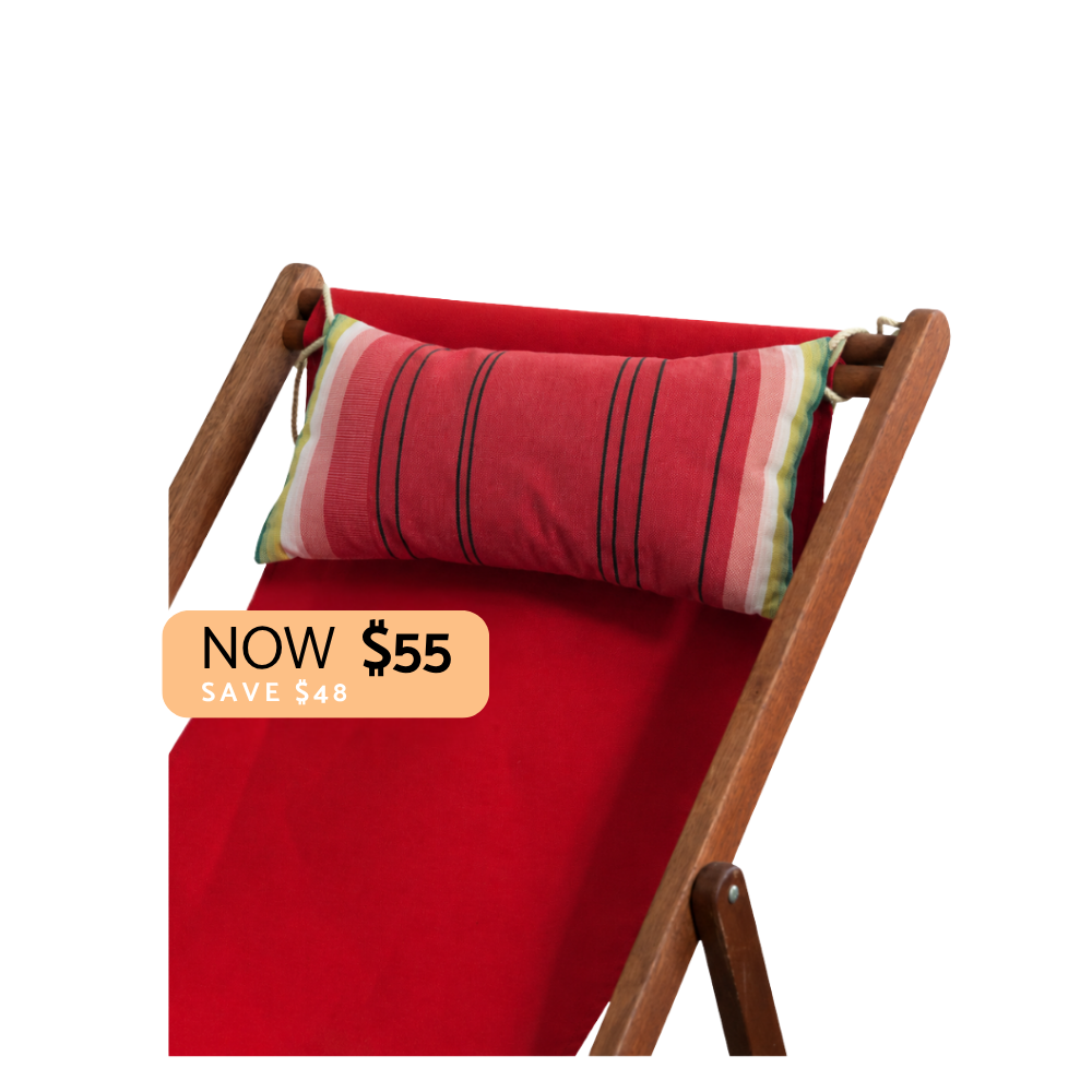 Watermelon colours in multi stripes head cushion on a red deckchair sling. Plain background