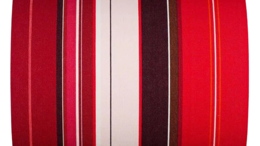 Petit Rue du Bac ROuge is a cotton fabric roll featuring bold stripes of bright red, deep burgundy, soft blush and dark chocolate brown, with fine white and orange accent lines. Made by Les Toiles du Soleil