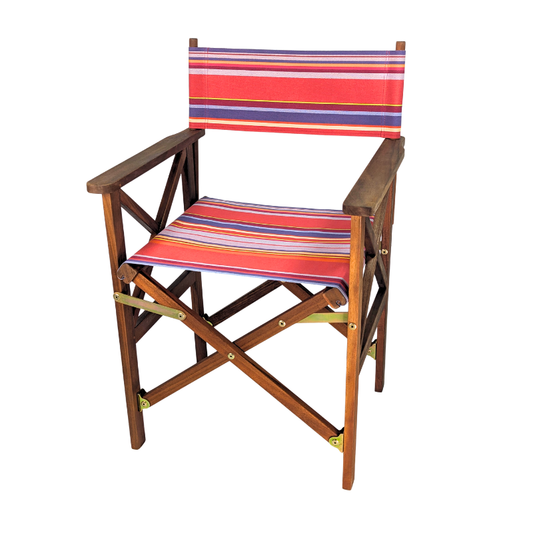 Hardwood directors chair with colourful multi-striped cotton fabric showcasing vibrant pinks, lavender, purple, yellow, and orange. Petit Sixtine is a fabric made by Les Toiles do Soleil. Placed on a white background