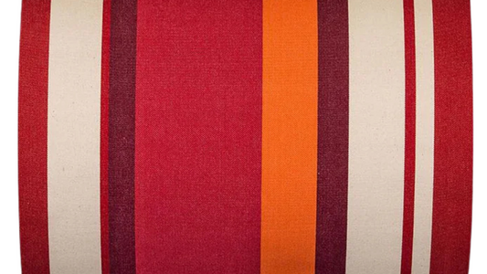 
Les Toiles du Soleil cotton fabric roll featuring bold stripes of deep red, bright crimson, orange, burgundy and warm écru. Fabric name - Pimiento