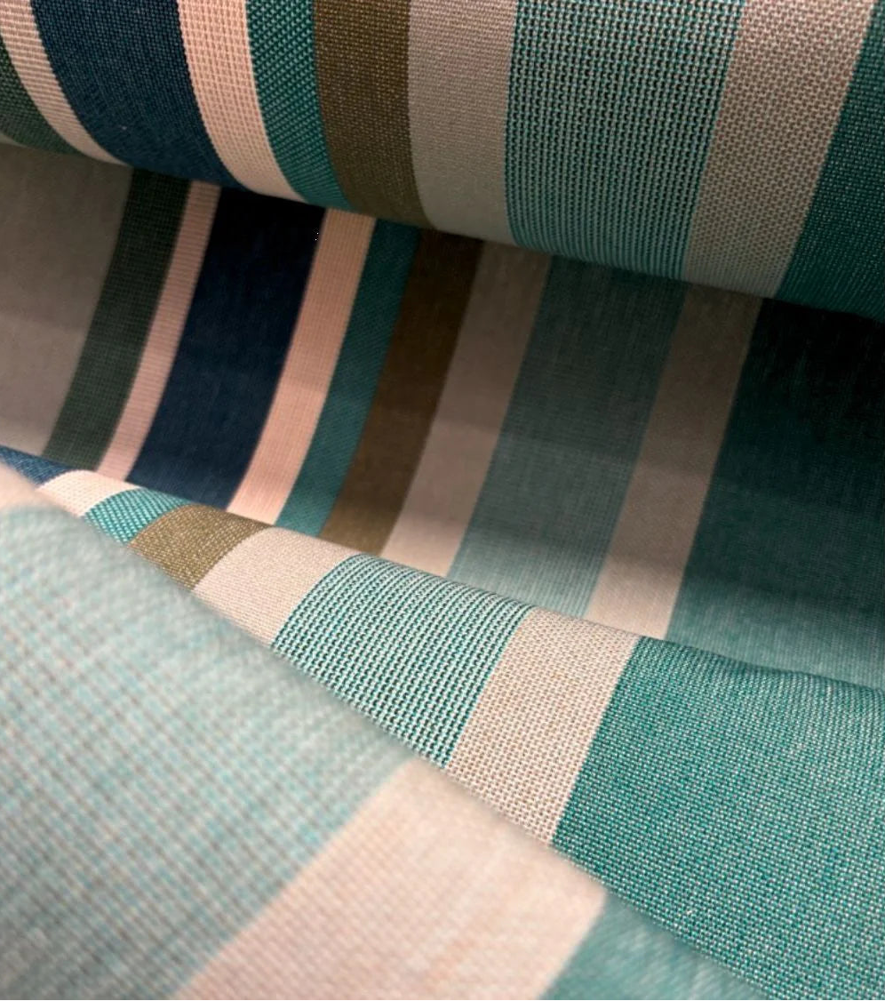 Close up of Place aux Herbes - a 100% cotton fabric roll which is a vibrant striped tapestry: fresh greens, almond, olive and taupe, by Les Toiles du Soleil.