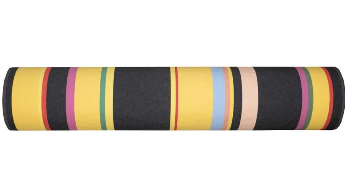 §00% cotton Les Toiles du Soleil fabric roll of Pollestres. A bold black, yellow, pinks and other colours in a multi striped pattern. 
