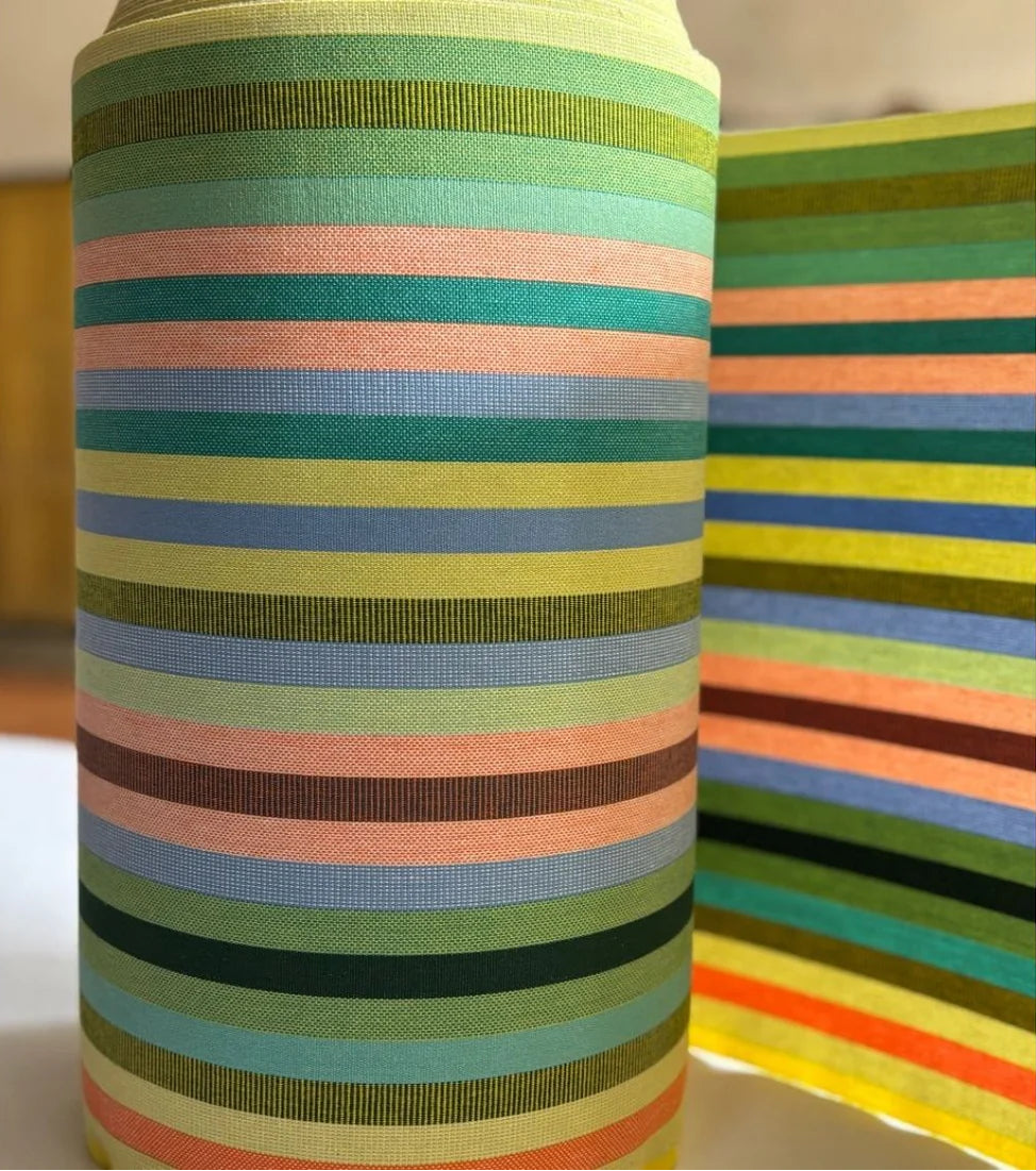 Pop Vert cotton fabric roll featuring teal, pink, blue, green, turquoise, and other vibrant coloured stripes.