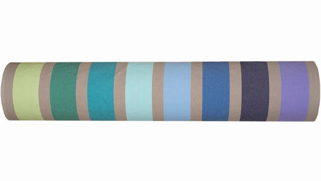 100% cotton fabric roll of Printemps, a Les Toiles du Soleil woven fabric of multi-coloured green, turquoises, and lilac stripes