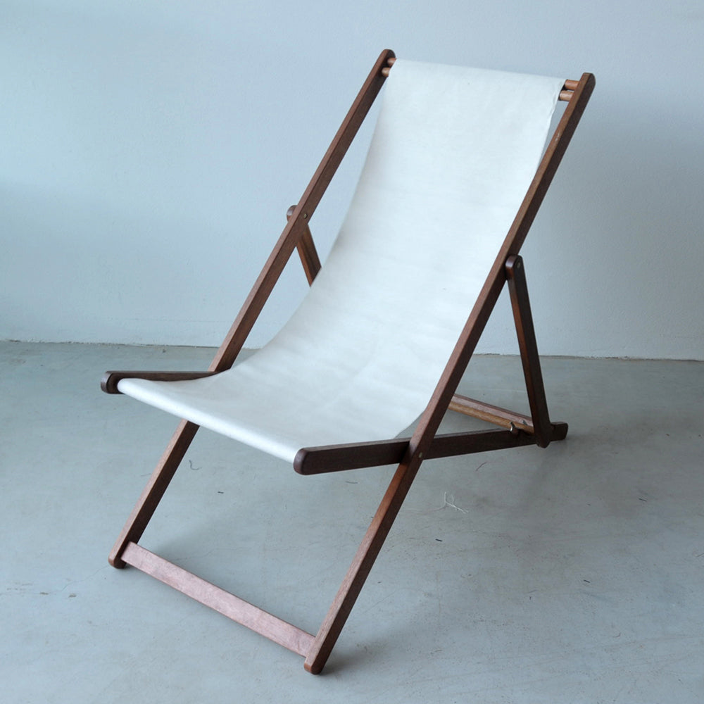 Ici et la hardwood deckchair made from the Oxford - A natural/ecru coloured 100% cotton 43cm fabric  by Les Toiles du Soleil