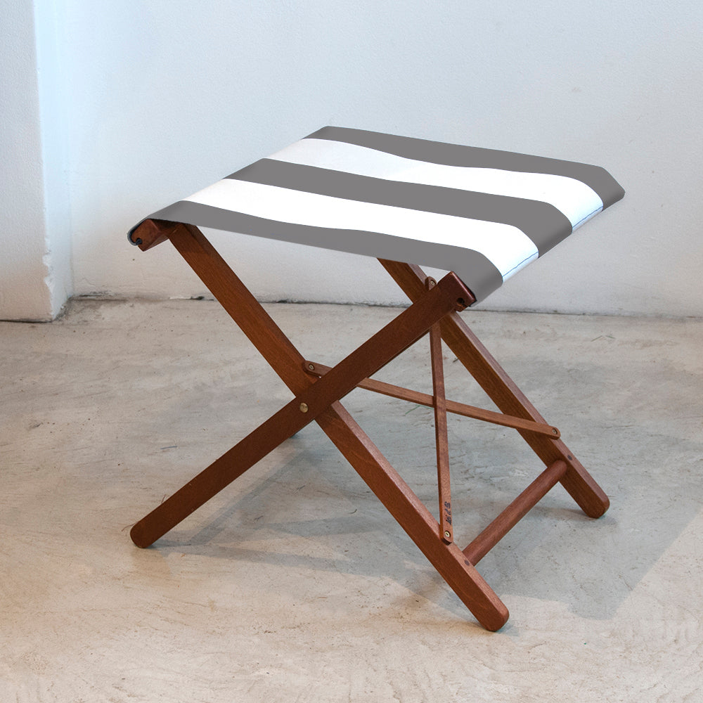 Ici et La folding stool with Sunbrella light grey and white striped fabric sling