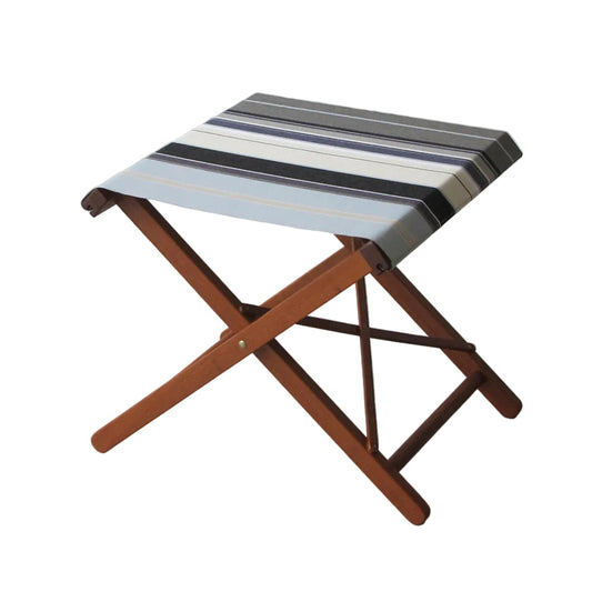A folding wooden stool with a striped fabric seat cushion, shown against a solid black background.