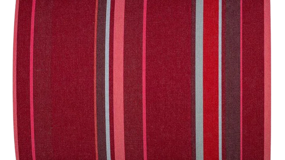 Cotton fabric roll featuring a deep ruby crimson ground with tonal stripes of fuchsia, rose, burgundy, bright red and fine grey accent lines.