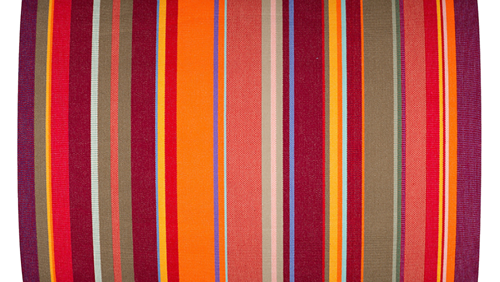 Colourful striped cotton fabric with vertical red, orange, and multicoloured stripes on a white background