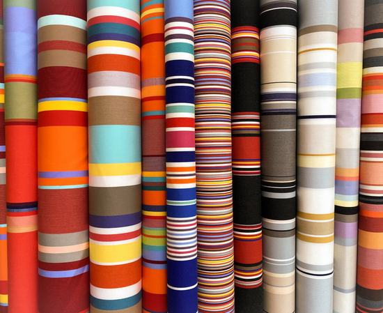 Sunbrella 43cm Deckchair ollection of colourful striped fabrics arranged in rows.