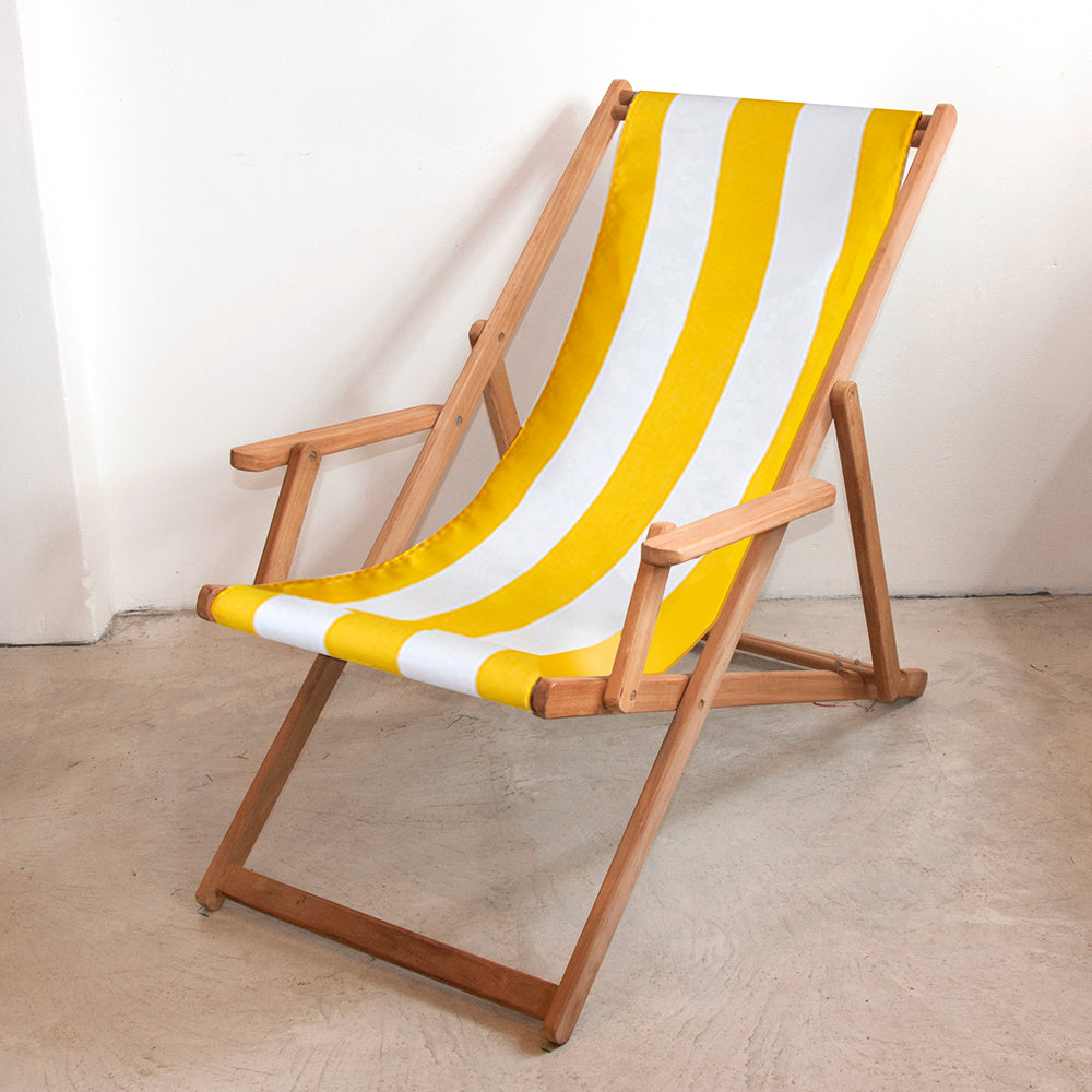 Ici et la teak foldable deckchair with arms with Sunbrella white and yellow fabric sling