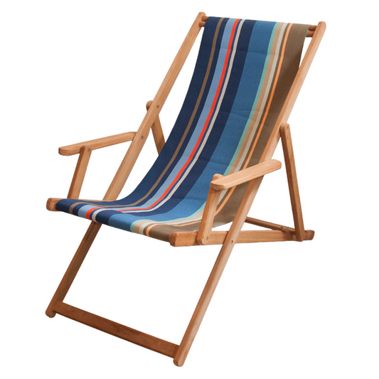Ici et la teak Deckchair with arms made from Collioure Roy - a fabric featuring a striped pattern with various bands in different shades of blue, beige, brown and red. A detailed 100% cotton weave by By Les Toiles du Soleil 