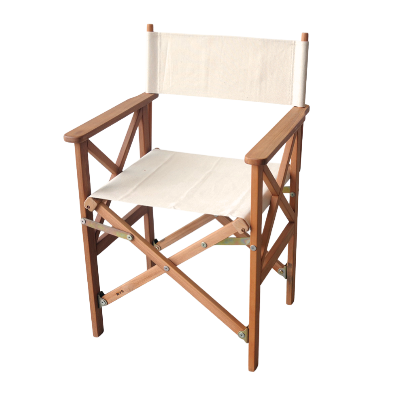 A foldable director's chair with a teak wood frame and white Oxford Les Toiles du Soleil cotton fabric.