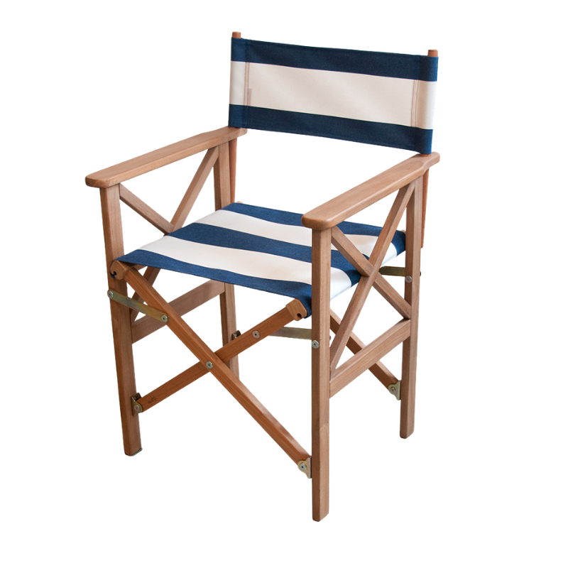 A folding director's chair with a teak frame and acrylic Sunbrella navy and cream striped fabric seat and backrest.