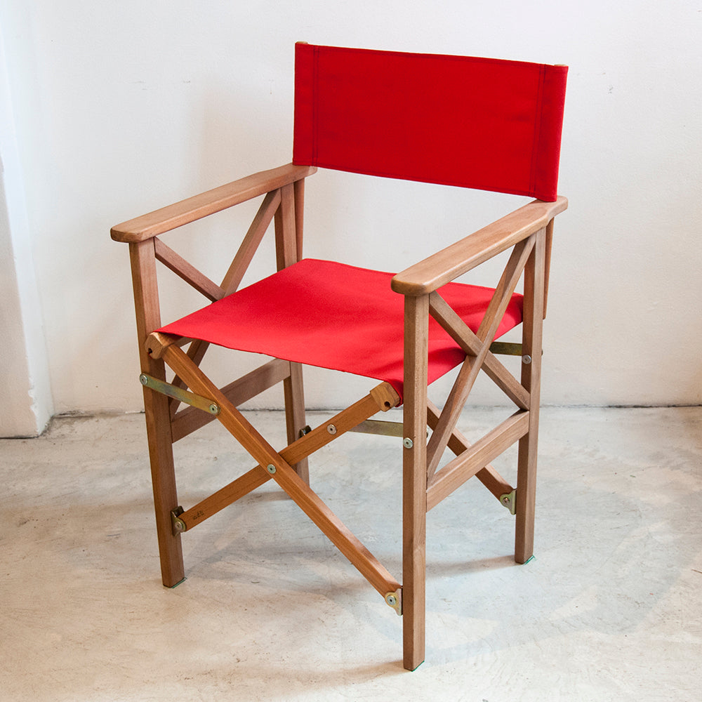 Sunbrella red synthetic outdoor fabric on a ici et la teak wooden director chair