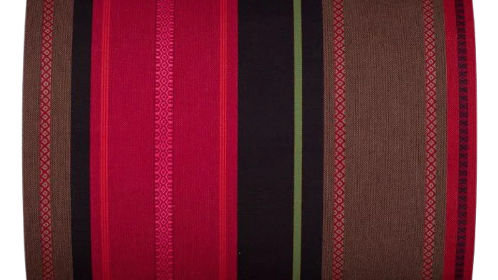 Cotton fabric roll featuring richly detailed stripes of deep red, fuchsia pink, dark navy, mauve and coral, with fine woven accent lines of lavender and lime green throughout.
