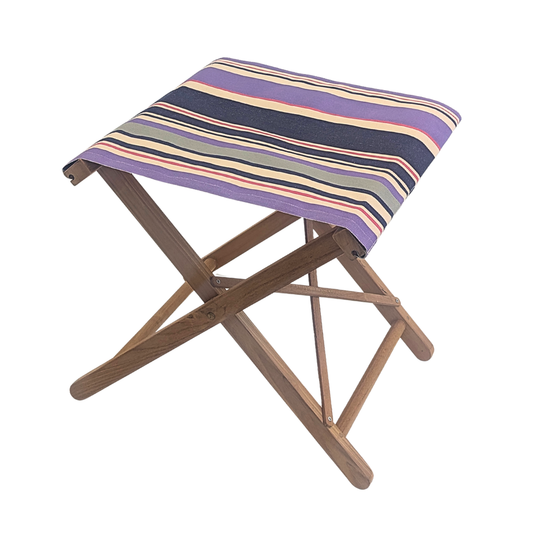 Teak folding stool with seat made from Les Toiles du Soleil  cotton fabric featuring navy, violet, and ivory stripes accented by fine crimson lines.