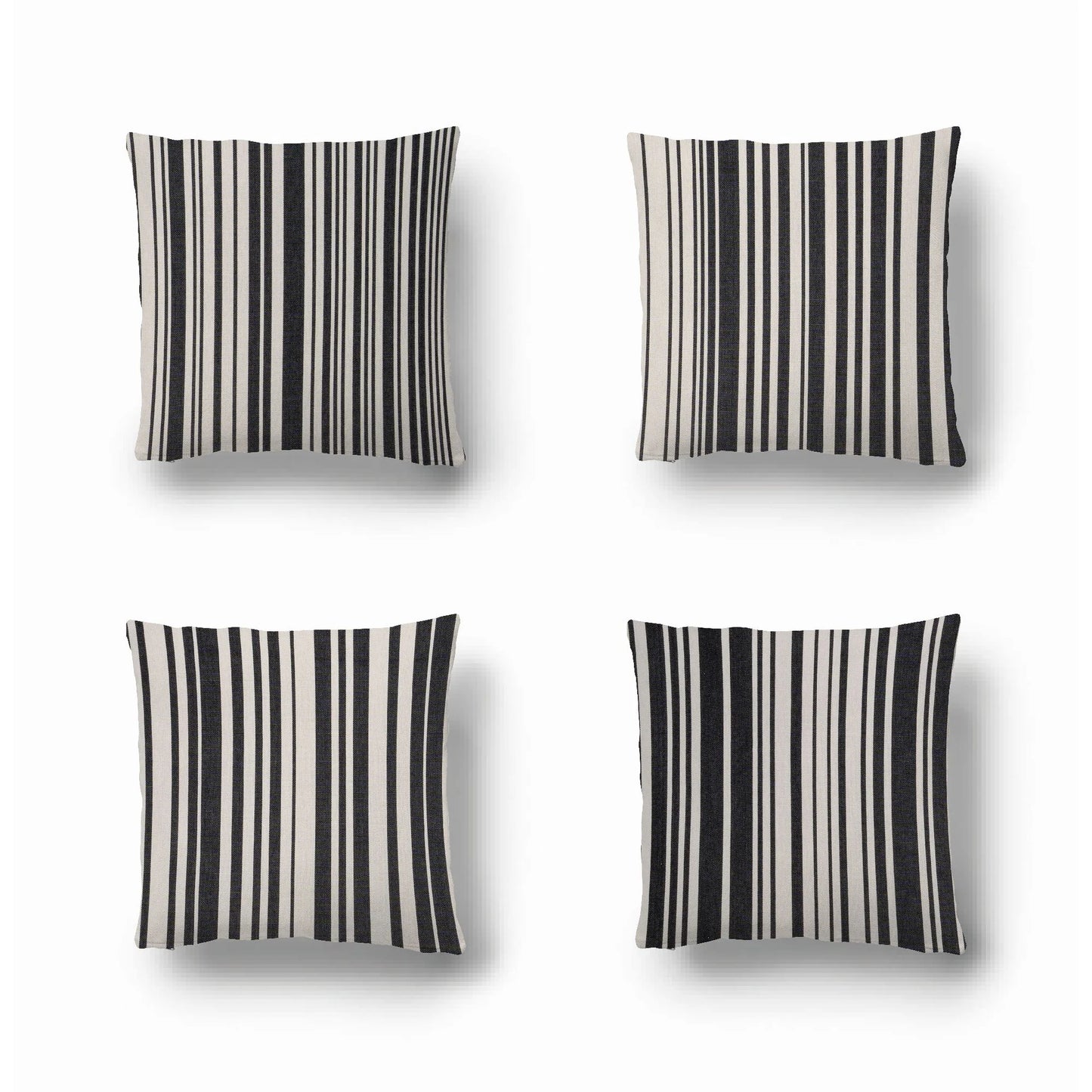 Cushions made from cotton fabric by Les Toiles du Soleil called Tom Black. A multi striped pattern of white and black - like a barcode