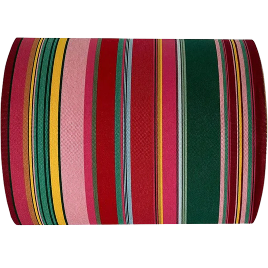 Cotton fabric roll featuring stripes of red, purplish crimson, candy pink, green, blue and golden yellow, inspired by the colours of the Catalan town of Toulouges and its famous onion.