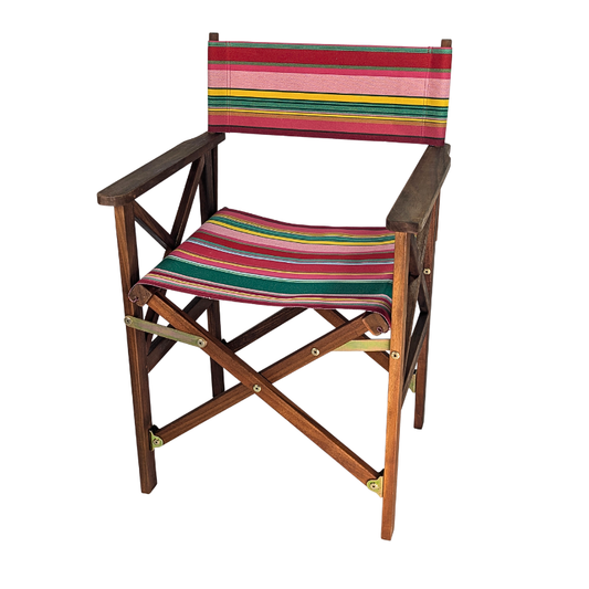 Hardwood deckchair in cotton fabric  featuring stripes of red, purplish crimson, candy pink, green, blue and golden yellow, inspired by the colours of the Catalan town of Toulouges and its famous onion. On a white background
